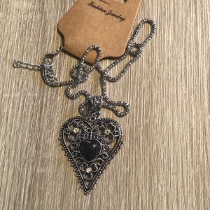 Silver heart shaped necklace on an 18” chain